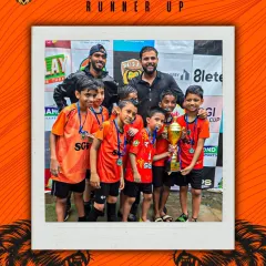 The joy of competition is what it's all about. Our young players and their coaches proudly pose as runners-up in the SGI Super Cup, a moment of achievement that fuels their passion for the game.