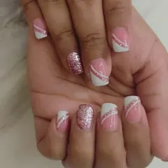 Another angle of the diagonal glitter line French manicure, showing the pink glitter accent nail that ties the whole set together.