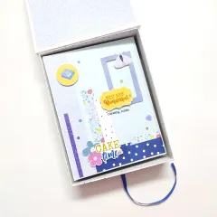 The A5 birthday scrapbook comes in a beautiful matching gift box with a pull-out ribbon.