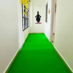 A simple yet effective way to brighten a home. We installed our vibrant artificial grass along this entire hallway, creating a surprising and playful path inside the house.
