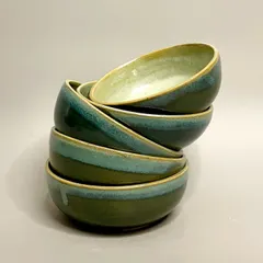 Elevate your everyday dining with this collection of handcrafted ceramic bowls. Finished in a beautiful dripping green and blue glaze, each bowl is lovingly crafted and truly unique.