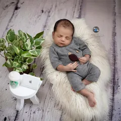 A humorous 'Back to Monday' theme for the modern baby. This little one is all set for a busy day with a tiny laptop, a cup of coffee, and a comfy place to nap.