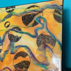 Another angle of this resin and doodle piece. The glossy finish of the resin makes the colors pop and protects the intricate line work underneath.