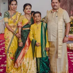 Another beautiful family portrait, this time in a vibrant yellow and green palette. I designed these coordinated outfits for a wedding, ensuring everyone from the parents to the children felt connected and stylish in their custom ethnic wear.