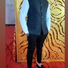 A client looking dapper in a dark Nehru jacket, also known as a bandi. I tailored this to be worn over a formal shirt for a sharp, Indo-western look.