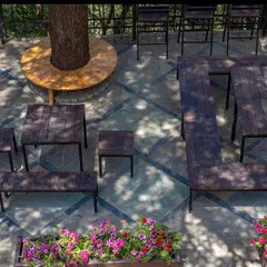 An overhead view of the flexible seating arrangements at the Woodstock School hub. The modular furniture can be reconfigured for different events and group sizes, demonstrating our focus on creating adaptable urban spaces.