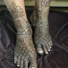 I also offer intricate mehendi for feet, perfect for brides or anyone wanting a complete look. This design features detailed checkerboard patterns and classic mandala work covering the entire foot.