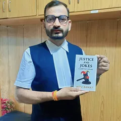 A formal photo with the book "Justice and Jokes." I encourage everyone to support the work of writers within our legal fraternity.