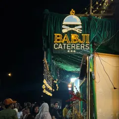 The view from outside our 'Eats & Treats' festival at night. The warm lights and bustling crowd create an inviting atmosphere that draws you in.