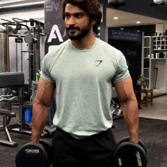 Beast mode, all day, every day. Holding heavy dumbbells, ready for the next set. The mindset you bring to the gym determines your results.