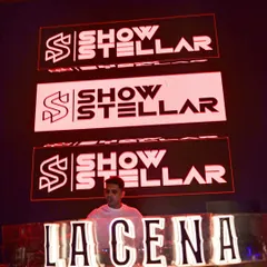 My branding front and center at La Cena. The visuals are a huge part of my show's identity.
