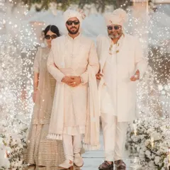 A stunning shot of the groom's entry with his parents. It's an honor to witness and be a part of such beautiful family moments.