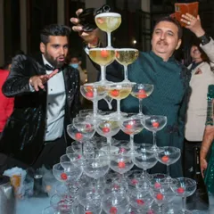 Nothing says celebration like a classic champagne tower. We build these magnificent structures, complete with dramatic dry ice effects, creating a perfect, timeless moment for weddings, anniversaries, and milestone events.