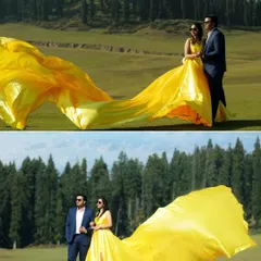 The drama of a flowing gown in the Kashmir valley. I use elements like this long, vibrant yellow train to add movement and a cinematic quality to my photographs, turning a beautiful landscape into a dynamic scene from your love story.