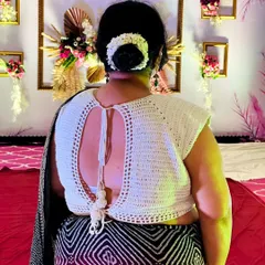 I love creating pieces that blend traditional style with a modern, handmade touch. This backless crochet blouse is a perfect example, designed to be a standout piece that is both elegant and unique for any special occasion.