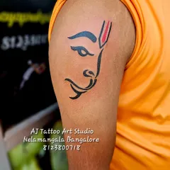 A minimalist yet powerful Hanuman tattoo on the upper arm. This design is simple, clean, and instantly recognizable.