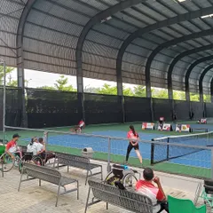 Spectators and players watch a match during the Tabebuia Open. Our facility is designed to be fully accessible and comfortable for athletes and fans alike.