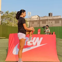 Warming up the calm before the storm. A simple leg stretch is a crucial part of my pre-run routine to ensure my muscles are ready for the work ahead.