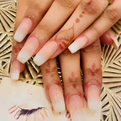 Extra-long, square-shaped nails featuring a beautiful and subtle baby boomer ombre. This look is perfect for a clean, sophisticated, and elongated nail appearance.