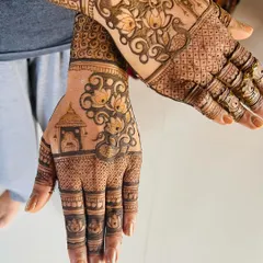 Here is a full view of a detailed design combining several elements. You can see a temple motif, lotus flowers, and peacock-inspired swirls, all tied together with intricate filler patterns.
