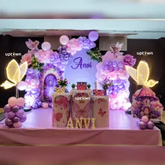 We bring magical themes to life with detailed decorations. This fairy and butterfly party features a stunning balloon arrangement in shades of purple and pink, custom-lit butterfly wing's, and themed plinths for the cake and dessert's, creating an enchanting world for the birthday girl.