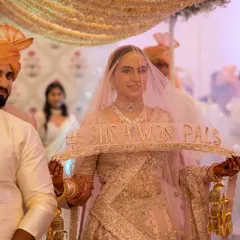 The plan was an outdoor Bangalore wedding, but the sky had other ideas. This shot captures the bride's stunning entrance after we moved the entire wedding indoors in record time. It proves that even with chaos, the story can be perfect.