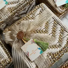 It was an honor to design these engagement invitation hampers for cricketer Rinku Singh and MP Priya Saroj. Each bespoke woven box was finished with a personalized gift tag and our signature wax seal, reflecting the opulence and importance of this special union.