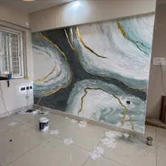 A work-in-progress shot of a granite mural, showing the scale and the materials used to achieve this fluid, stone-like effect. Even before it's finished, the impact is clear.