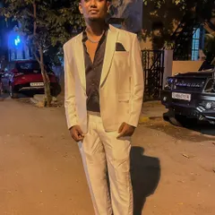 Dressed up in a white suit, ready for a high-end private event. I can adapt my style to match the formality of any occasion, from club nights to corporate gigs.