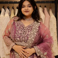Here is a closer view of the mauve-pink lehenga, highlighting the detailed silver threadwork on the blouse and skirt. It's a sophisticated piece for anyone wanting an elegant look.