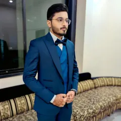 The complete look. This groom's hair is perfectly styled, and his makeup is subtle, ensuring he looks polished from every angle.