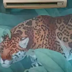A close-up of a leopard wallpaper mural, showcasing the rich detail and color. This type of bold, nature-themed design is perfect for making a statement in a themed room or commercial space.