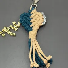 A close-up of a personalized keychain with the name 'PRIYA' spelled out in letter beads. I can customize these with any name!
