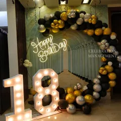 This is the full view of the chic 18th birthday setup, showing how the balloon ring frames the space and the marquee numbers create a focal point.