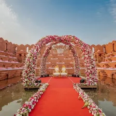 A closer look at the floating mandap at this royal venue. The combination of floral arches, a grand chandelier, and the water element makes for an absolutely breathtaking wedding ceremony spot.