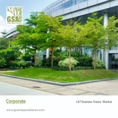The landscape for the L&T Business Towers in Mumbai features clean lines, manicured lawns, and strategically placed trees. This corporate campus design projects a professional and modern image while providing green breakout spaces for employees.