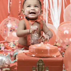 With a face full of cake and a heart full of happiness, this little one is having the time of his life. Our cake smash photos focus on capturing genuine expressions of joy.
