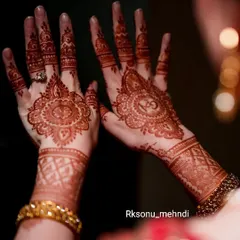 The rich, dark stain of an engagement mehndi, glowing beautifully during the ceremony. This is the color I always strive for, ensuring your hands look spectacular for your big event.