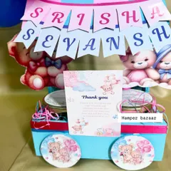 Double the joy! A close-up of our twin celebration hamper for Srisha and Sevansh, featuring a personalized name banner.