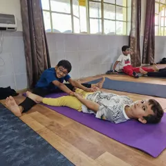 Little yogis learning to support each other. This partner stretch helps develop flexibility and trust, all while sharing a playful moment.
