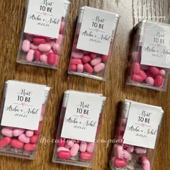 A sweet and simple favor for your wedding guests. These "Mint to Be" boxes are personalized with the couple's names and wedding date, offering a refreshing treat.