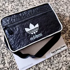 How about an edible 'Adibas' bag for your birthday? This cake was carved to look like a leather sling bag, complete with a textured finish, zipper details, and the iconic logo.