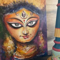 A close-up of the Durga painting, highlighting the detailed jewelry, the third eye, and the intense expression that I worked to capture.