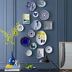 A gallery wall of decorative plates can be a unique form of personal expression. We arranged this collection of blue and white plates of various shapes and patterns against a bold blue wall to create a striking focal point.