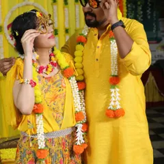 The happy couple sharing a playful moment during their Haldi ceremony. We focus on creating beautiful, candid moments that you'll cherish forever.