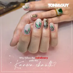 Getting ready for Karwa Chauth with a festive nail design. This look features delicate leaf patterns and a touch of gold glitter on a neutral base, offering a unique twist on traditional red.