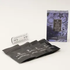 The complete car fragrance set, including the metallic vent clip and four refill packs. Each refill lasts for two weeks, providing a total of eight weeks of continuous, natural fragrance for your journey.