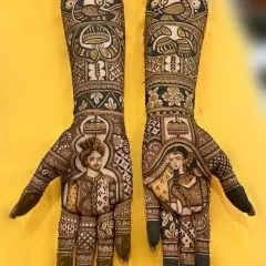 My specialty is creating lifelike bride and groom portraits. This design shows a detailed groom portrait on one palm and the bride on the other, framed by intricate patterns and peacock motifs on the arms. I focus on getting the expressions and features just right. (Also shown in images 20 and 25).