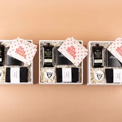 A trio of our groomsmen hampers, ready to be gifted. We ensure consistency and quality across all boxes for the entire groom's party.