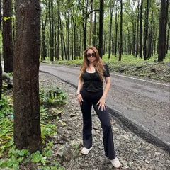 Another pose from my Jim Corbett trip, showing how a simple black outfit can be both stylish and comfortable for travel.